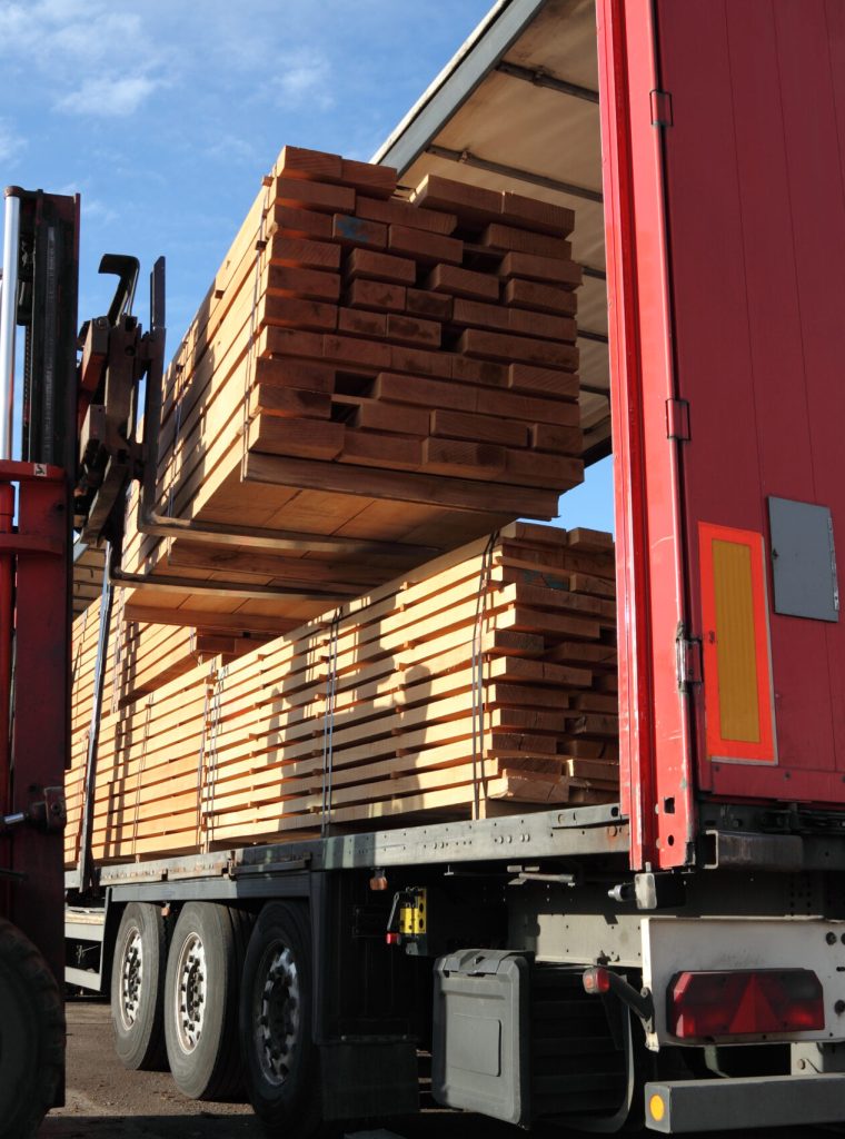 Forklift loading stacks of beech boards on a truck. Please see related pictures: